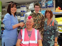 Scott styles hair into pink mohican for Autism Awareness Week