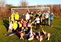 Village celebrates new goal posts with kids vs adults football game