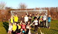 Village celebrates new goal posts with kids vs adults football game
