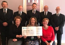 Funeral directors donate £300 to cancer support through Tree of Remembrance