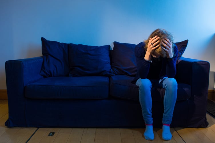 PICTURE POSED BY MODEL A woman showing signs of depression.