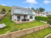 This modern home features gorgeous views and a Wi-Fi kitchen 