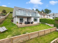 This modern home features gorgeous views and a Wi-Fi kitchen 