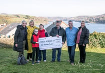 Rotary club presents cheque to Cancer Research UK