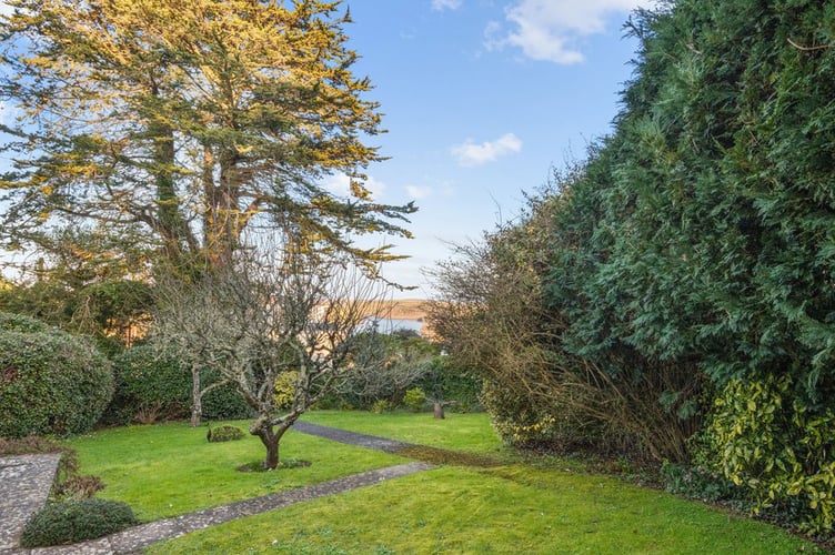 Mature garden surrounding the 1970s house in Salcombe, Devon. See SWNS story SWLNhouse. An incredible 'time warp' 1970s home with original patterned wallpaper, lino and apricot tiles has gone on the market - for £1million. The four bedroom property was originally built in the seventies and has been with the same owners for almost 40 years. The house is described as being "ready for modernisation" but some 70s fans may want to leave the decor exactly as it is.