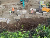 Wall comes down at housing development