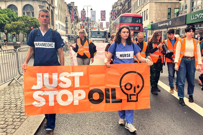 Some of those who took part in the Just Stop Oil slow march in London on Friday, May 26.