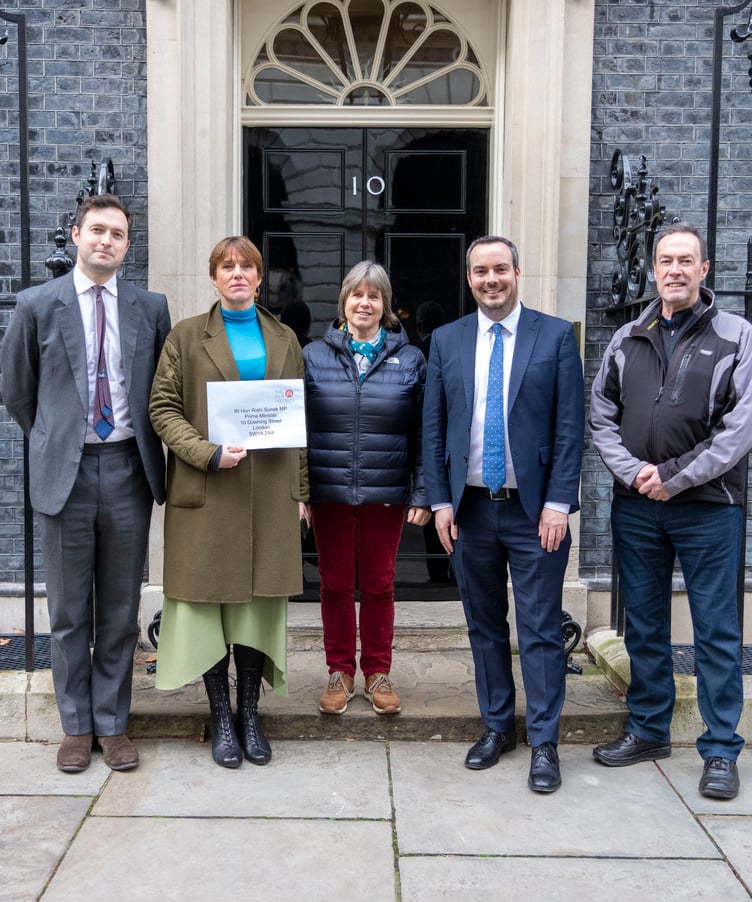 FREE EDITORIAL & ONLINE USE © Jeff Moore The Filo Project, a dementia care social enterprise, handed in an open letter at Downing Street today, calling for an end to an unfair VAT rule that adds 20% to dementia care costs faced by families. The Filo Project offers unique, award-winning day care within hostsâ homes for small groups of socially isolated older people with early to moderate dementia in the South West and East Lancashire.
Pictured: Libby Price(blue scarf), Dr Liz Dennis(green jacket), Peter Kempton whose mother Margaret attended a Filo group, and supportive MPs Simon Jupp (East Devon)and Anthony Mangnall (Totnes)