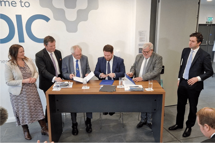 Signing the Torbay/Devon devolution deal (from left) Alison Hernandez, Kevin Foster John Hart, Jacob Young, David Thomas, Anthony Mangnall