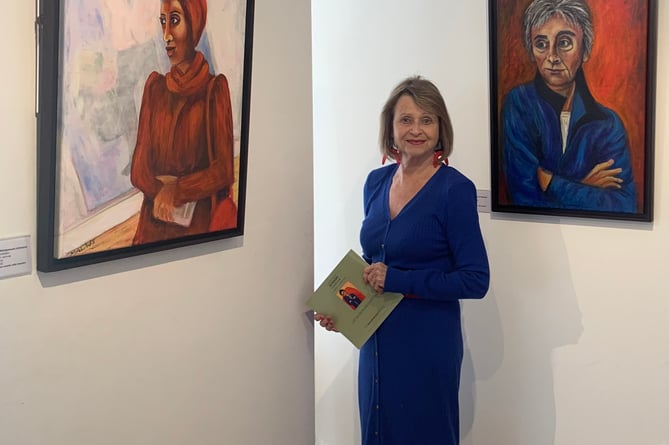 Brownston Prize winner Marilyn Wedgwood-Johnson with two of her paintings in the exhibition