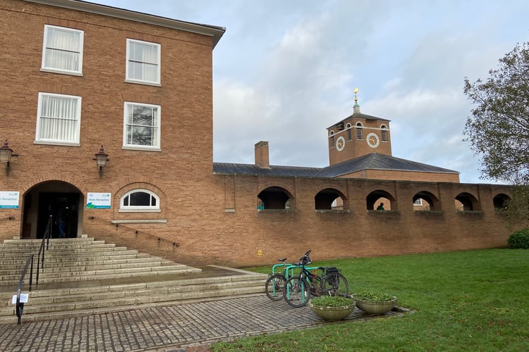 Devon County Council says it will have a £163m deficit in its spending needs budget by the end of the financial year