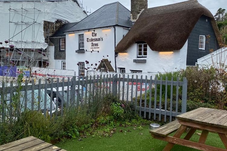 The Tradesman's Arms next to cottages still under reconstruction