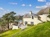 "Fabulous" cottage for sale has beach views and woodland gardens