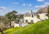 "Fabulous" cottage for sale has beach views and woodland gardens