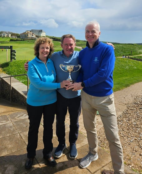 John Batchelor trophy winners Sue and Alec Esplin, alongside club captain Jim Stewart