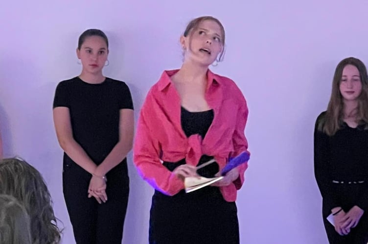 Violet Fendick, reciting Elle’s Courtroom speech, from Legally Blonde as part of a series of all-female monologues. People in the background are Daryna Handzeshyna (l) and Holly Cumming (r)