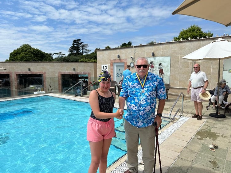 Swimmer Emily Worthington with Kingsbridge Rotary President Alan Thorpe