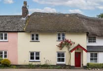 Period cottage for sale overlooks stream and is full of "timeless charm"