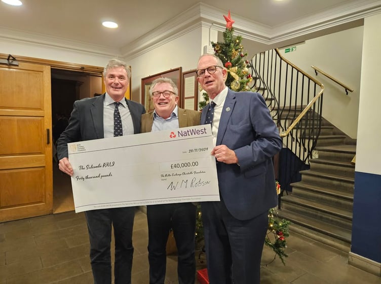 L to R: Chief Executive of the Baltic Exchange Mark Jackson, Bruce Munroe and Chairman of Salcombe RNLI Philip Ward