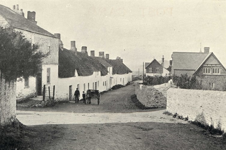Main street of Bantham village, looking towards the sea. Sloop Inn on the left.