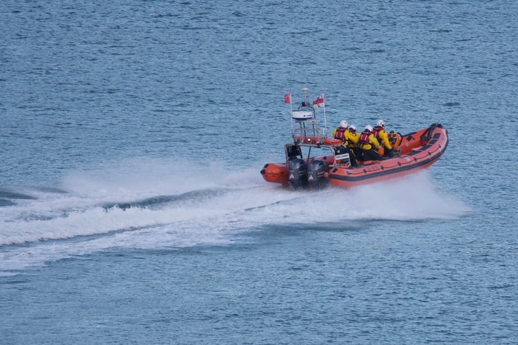 Dart RNLI Atantic class ILB and crew headed out to a yacht in difficulties south of Castle Cove.