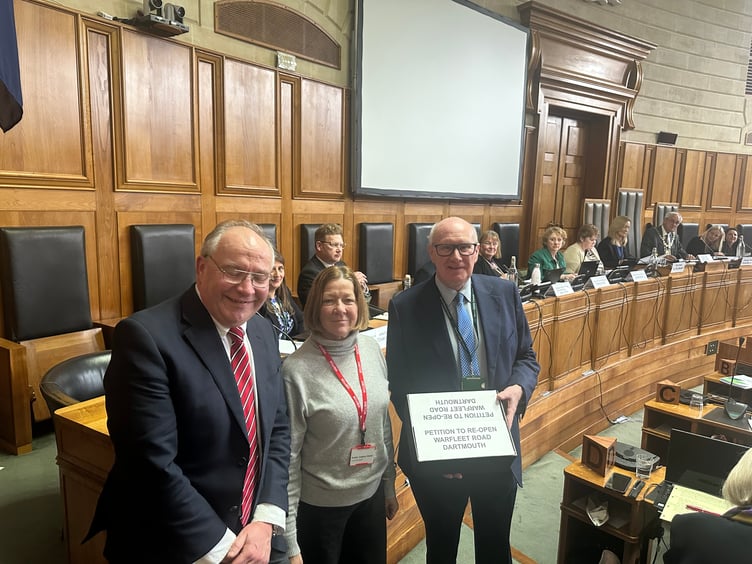 From left to right: Cllr Jonathan Hawkins, petition organiser Lindsay Ellwood, and Devon County Council leader, James McInnes