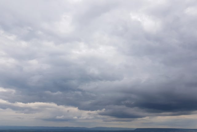 Partly cloudy with occasional sun and low chance of rain
