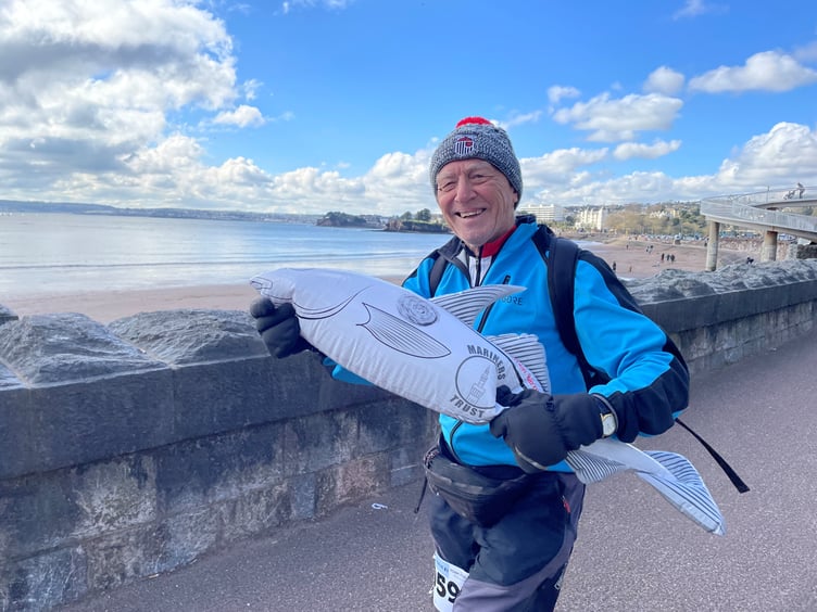 Ian Nuttal, 77, of Kingswear took part in the walk with his inflatable Grimsby Town Football Club mascot – Harry the Haddock