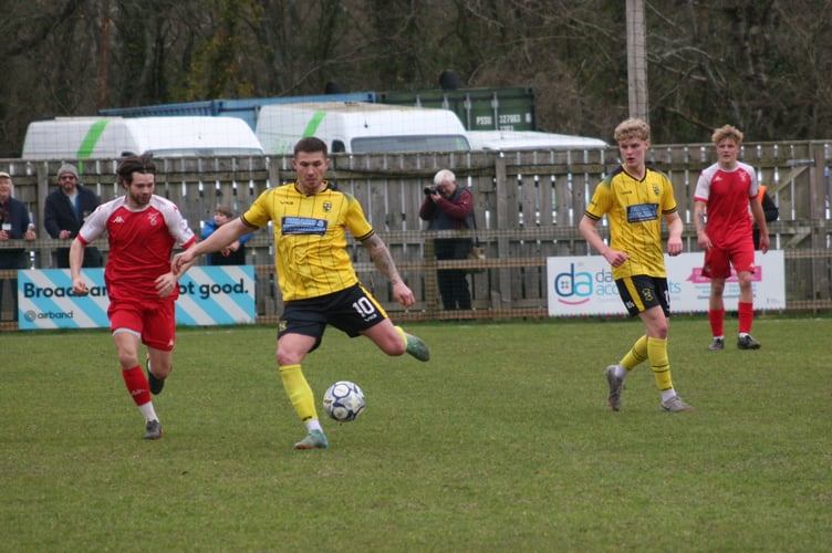 Jared Lewington on the ball for Buckland Athletic