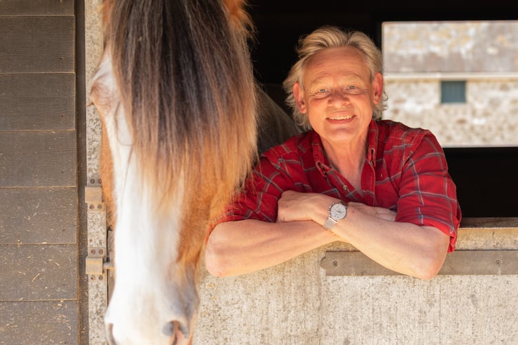 Martin Clunes is the special guest due to open the Devon County Show heavy horse festival in May.  The actor is pictured with his own Clydesdale horse Patrick.