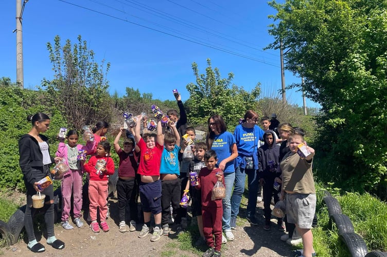 Members of the PUMA team with children in Ukraine