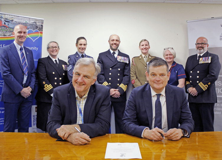 A gathering of military and hospital leaders for the re-signing of the armed forces covenant