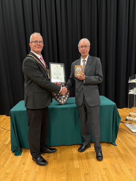 Mayor Alan Spencer presents the award to Colin Smith