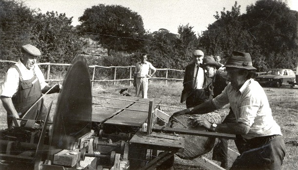 Men operating a rack saw.