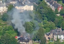 Firefighters tackle Totnes blaze destroying the roofs of two homes