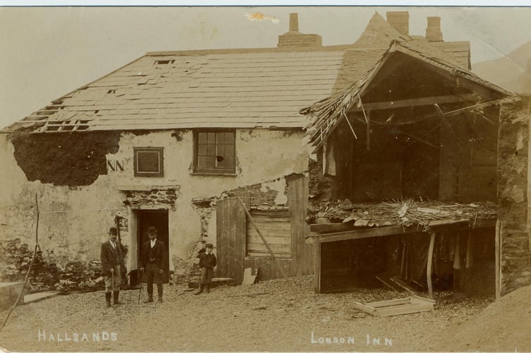 1904 two men and a boy outside storm damaged London Inn, Hallsands