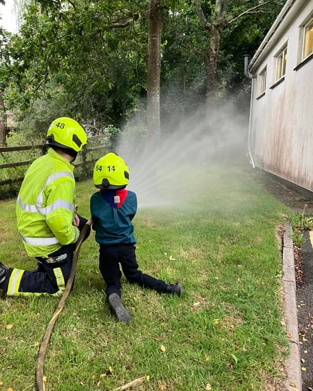 A scout tries out the hose