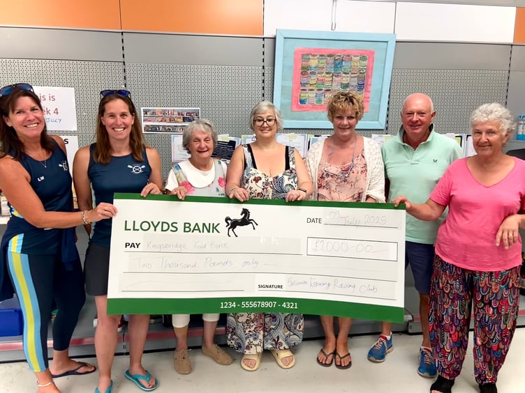 Salcombe Estuary Rowing Club donating £2,000 to Kingsbridge Food Bank. With Lisa (Joint Ladies Captain), Donna (SERC Chair), Eve, Gerry, Paula, Tony and Paula.