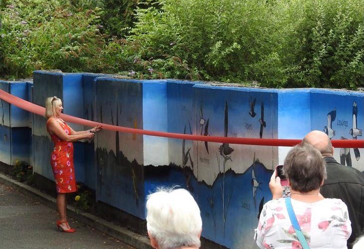 Janine Jansen cuts the ribbon to unveil Modbury's Marvelous Mural