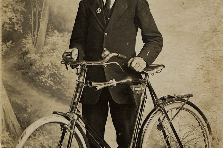 Portrait of man with bicycle around 1910. 
Identified as Bert Stone, shoemaker in East Prawle