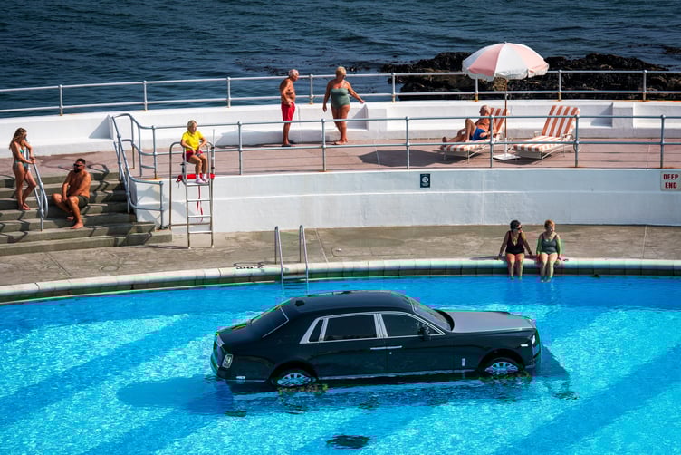 A Rolls Royce has been spotted in a public swimming pool - sparking rumours of a new Oasis album cover shoot. The expensive car was seen taking a dip at Tinside Lido on Plymouth's sea front in Devon. It was closed to swimmers for an "exclusive event" involving a Rolls-Royce and a film crew. Onlookers speculated it could be for a new Oasis album - the band's Be Here Now featured a Roller in a pool. But Rolls Royce have said it was "exciting global moment" for the firm and promised to more details soon.