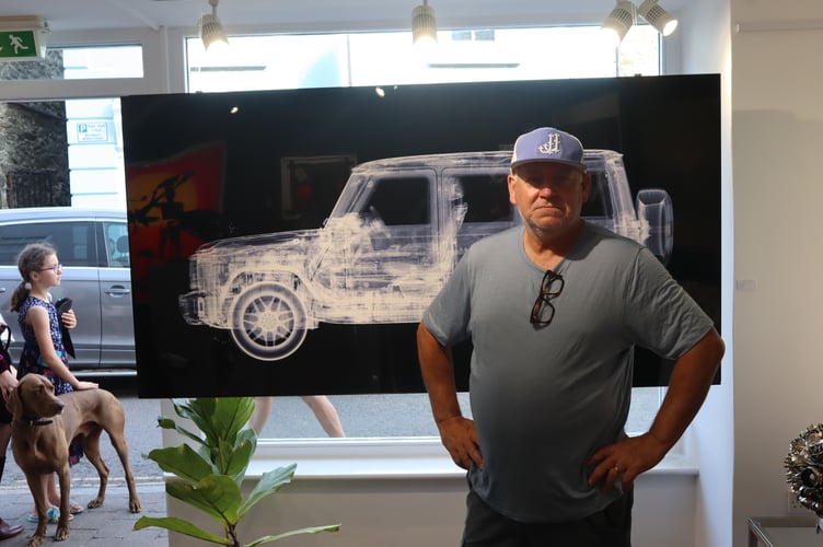 Nick Veasey standing with one of his X-ray artworks at the Drang Art Gallery.