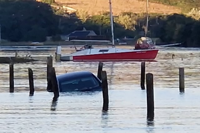 Driver and dog rescued from rising tide at Westcombe beach