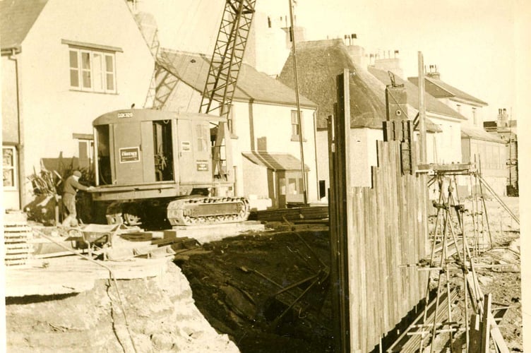 Photograph from the Toms family collection. Installation of sea defences at Torcross, 1950's.