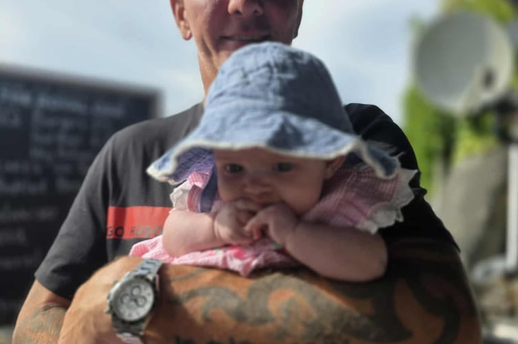 Macey-Mai with her grandad Andrew Milne at the fundraising event at The Royal Oak on Saturday. Picture: Katelyn Clarke