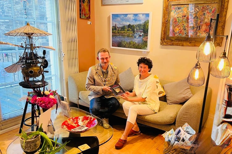Mayor Tim Benett and Dr. Kalina Borska Sitting in Waiting Room Surrounded with Totnes Art