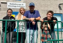 Watch Ivybridge dad play guitar during brain operation