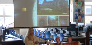 Local author inspires students with reading challenge