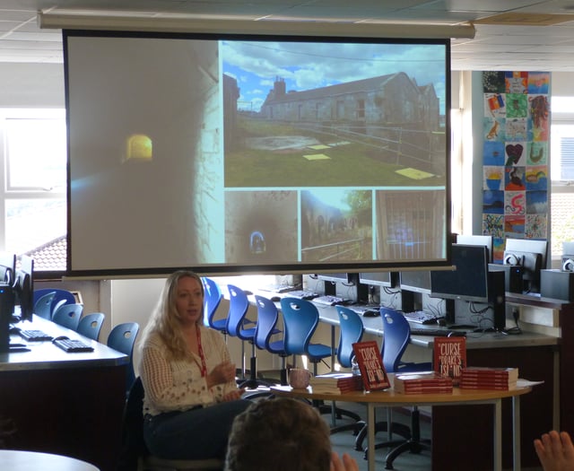 Local author inspires students with reading challenge