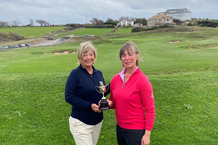 Lesley Davey is presented with the Tregelles trophy by ladies captain Fiona Turner